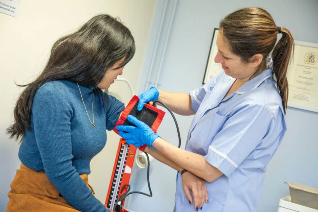 nurse assisting patient with blood pressure test i 2024 08 19 22 44 52 utc 1024x683 1